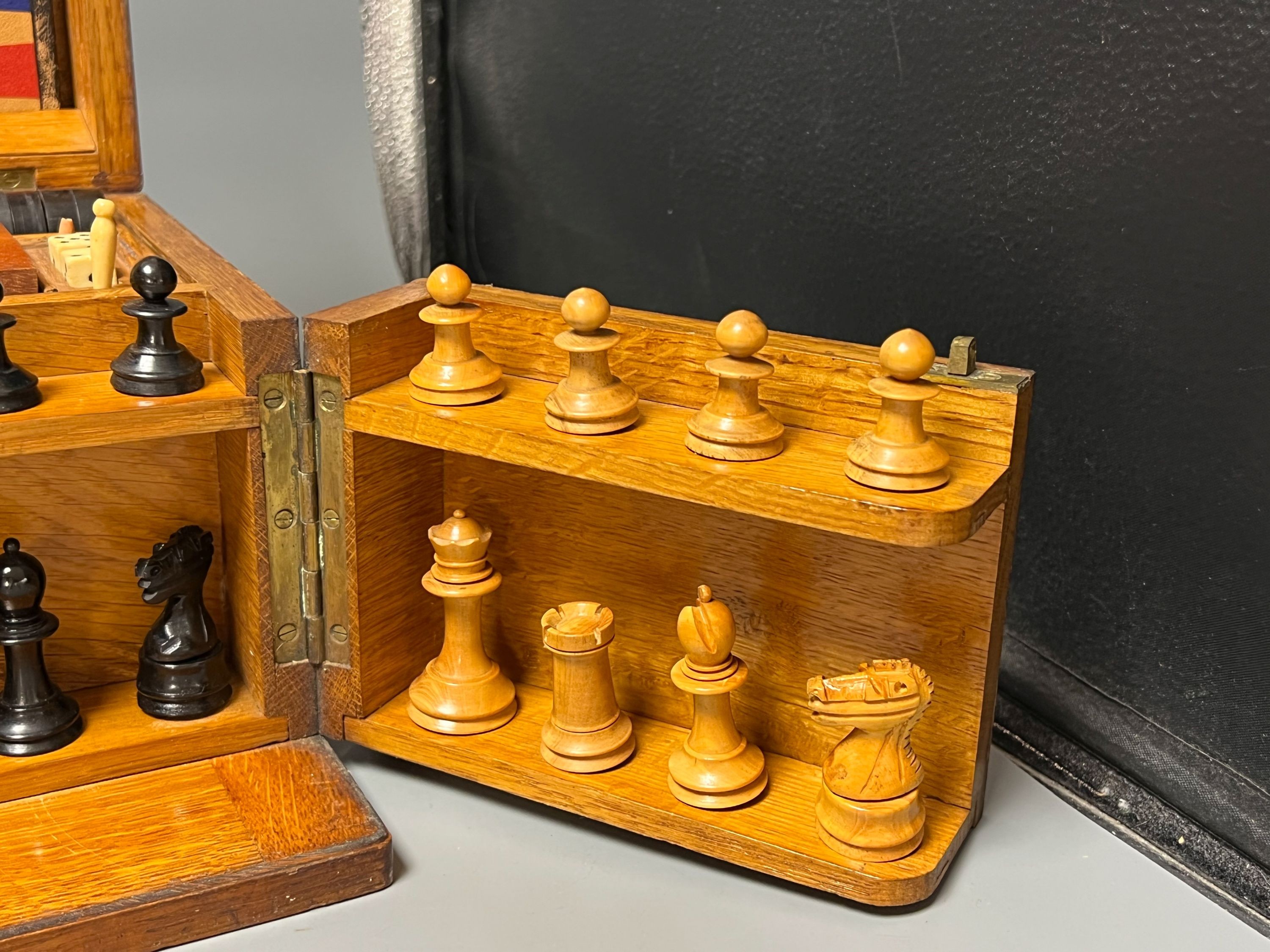 A Victorian oak games compendium, 32cm wide